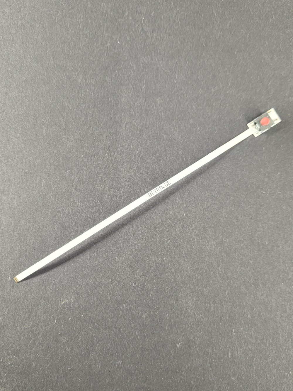 Flex cable plastic push-button